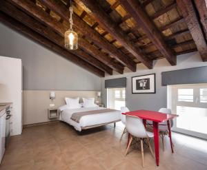 Postel nebo postele na pokoji v ubytování Catalina Suites San Nicolas