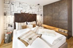 Säng eller sängar i ett rum på Katschberg Lodge