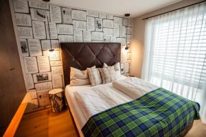 Postel nebo postele na pokoji v ubytování Katschberg Lodge