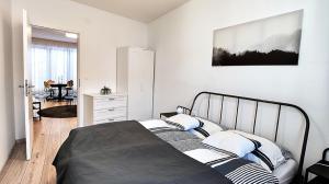 A bed or beds in a room at Piacsek Apartmanház