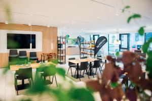 TV a/nebo společenská místnost v ubytování myNext - Hotel Leo