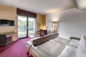
Ein Bett oder Betten in einem Zimmer der Unterkunft Linsberg Asia Hotel, Spa & Therme - Adults Only
