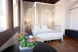 Кровать или кровати в номере Apartamentos Casa del Aceite