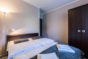 Posteľ alebo postele v izbe v ubytovaní Apartament Sarnia Skała