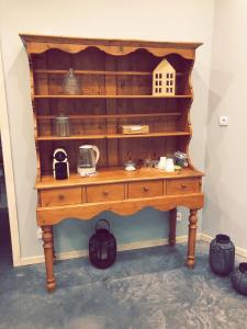 a wooden table with a shelf with a house on it at Nuit en Ville Pompidou Lille La Madeleine in La Madeleine