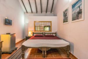 En eller flere senge i et værelse på Rodrigues Guest House