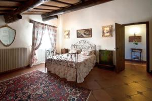 Postel nebo postele na pokoji v ubytování Agriturismo Renello
