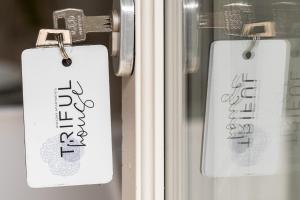 a close up of a door with signs on it at trifulhouse holiday apartments in Alba