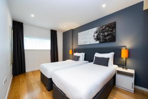 A bed or beds in a room at Staycity Aparthotels London Heathrow 