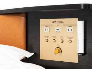 Cama ou camas em um quarto em APA Hotel Kyoto Ekimae
