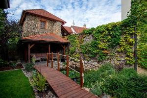 a wooden walkway in front of a house at Hotel Anna in Beroun