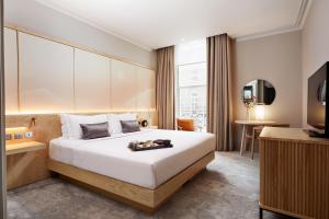 Ένα ή περισσότερα κρεβάτια σε δωμάτιο στο The Prince Akatoki London