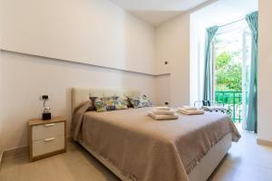 Giường trong phòng chung tại Terrazza Bonito
