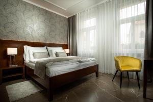 Posteľ alebo postele v izbe v ubytovaní Hotel Anna