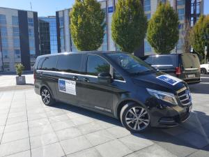 a black van parked on the side of a street at Idea Hotel Milano Malpensa Airport in Case Nuove