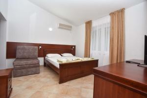 Letto o letti in una camera di Hotel Galeb