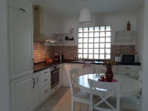 A kitchen or kitchenette at Kálium Vendégház