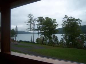 a view of a lake from a window at Cobblescote on the Lake in Cooperstown