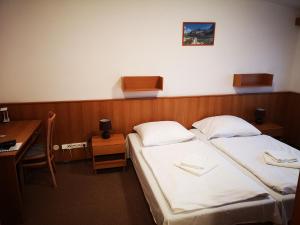 Postel nebo postele na pokoji v ubytování Apartmány EKOSERVIS SLOVENSKO