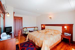 Postel nebo postele na pokoji v ubytování Hippodrome Hotel