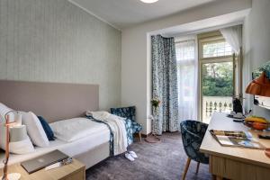 Posteľ alebo postele v izbe v ubytovaní ASTORIA Hotel & Medical Spa