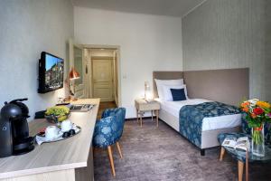 Posteľ alebo postele v izbe v ubytovaní ASTORIA Hotel & Medical Spa