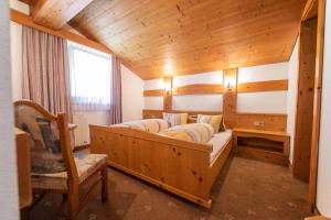 Postel nebo postele na pokoji v ubytování Hotel Garni Pfandl