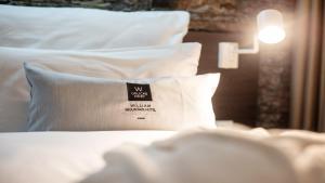 Posteľ alebo postele v izbe v ubytovaní WILLIAM Congress&Wellness Mountain HOTEL ****