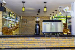 a bar with a blender on a counter at Blossoming Romduol Boutique in Siem Reap
