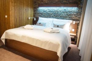Posteľ alebo postele v izbe v ubytovaní WILLIAM Congress&Wellness Mountain HOTEL ****