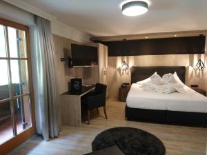 Postel nebo postele na pokoji v ubytování Hotel Möderle