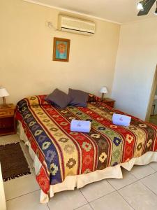 Postel nebo postele na pokoji v ubytování Terrazas de Colón + 26 fotografií