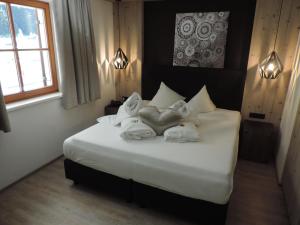 Postel nebo postele na pokoji v ubytování Hotel Möderle