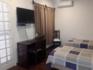 Giường trong phòng chung tại Hotel Casa Jardin