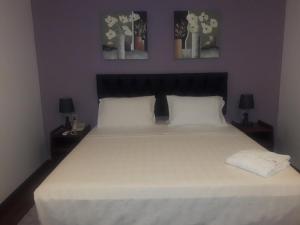 Giường trong phòng chung tại Hotel Casa Jardin