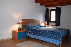 Кровать или кровати в номере Case Gran Paradiso Villaggio Melignon