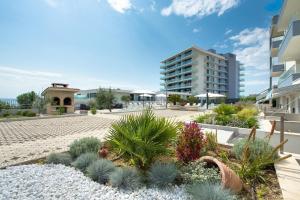 a courtyard with some plants and a building at Apartments Kamelija in Split