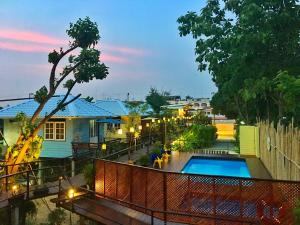 a view of a resort with a swimming pool at Mango House Sukhothai in Sukhothai
