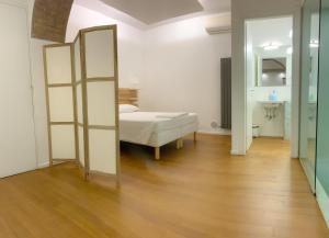 Posteľ alebo postele v izbe v ubytovaní La Pigna Boutique Apartment