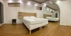 Posteľ alebo postele v izbe v ubytovaní La Pigna Boutique Apartment
