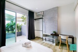 Postel nebo postele na pokoji v ubytování JOMSTAY Octagon Ipoh Suites