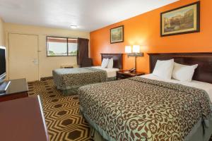 Ένα ή περισσότερα κρεβάτια σε δωμάτιο στο Travelodge by Wyndham South Holland