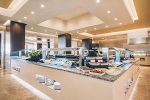 a buffet line with a lot of food at Iberostar Selection Kuriat Palace in Monastir