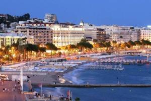 a view of a city with a beach and buildings at Lux Studio our swimming pool and garden in Cannes