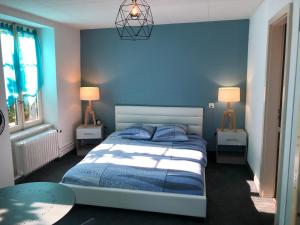 En eller flere senge i et værelse på Le Bras d'Or