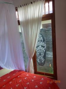 Giường trong phòng chung tại Murnis Bungalow