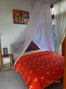 Giường trong phòng chung tại Murnis Bungalow