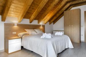 A bed or beds in a room at Casa Marosa