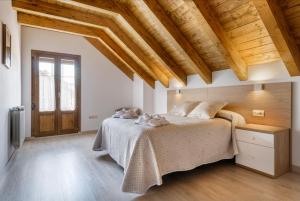 A bed or beds in a room at Casa Marosa