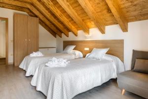 A bed or beds in a room at Casa Marosa